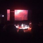Low resolution, fair use image of Ani Difranco concert.
