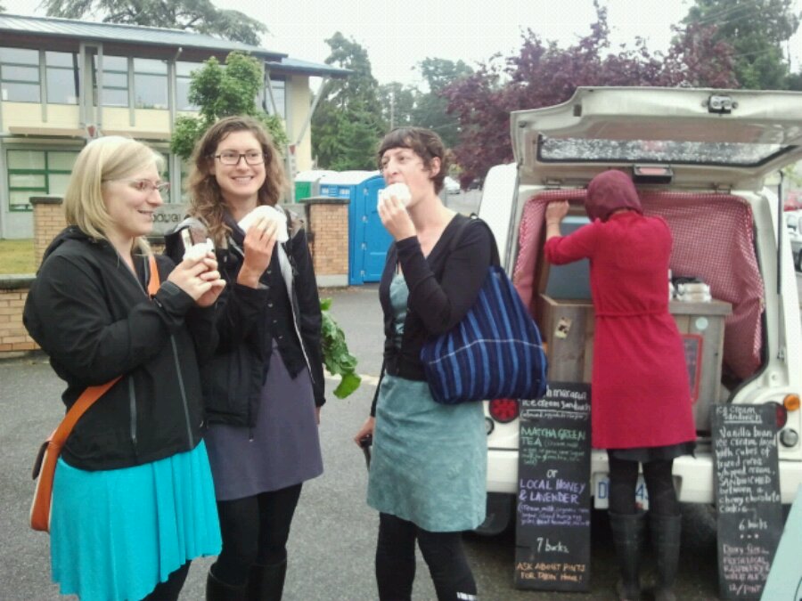Becky Cory and Jess and Sarah Mundy have ice cream sandwiches at the Moss Street Market