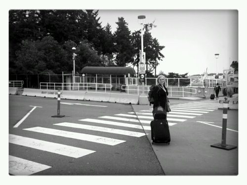 Rebecca Cory stands with her luggage about to embark on a Ferry to Vancouver