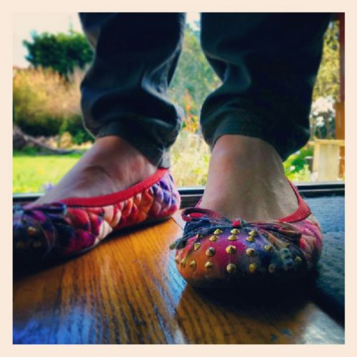 A close up of Gilda Shannon's feet and shoes on the step of your back yard.