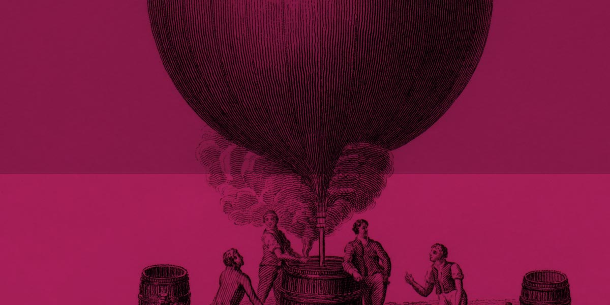 old illustration of men standing around filling a balloon with hot air