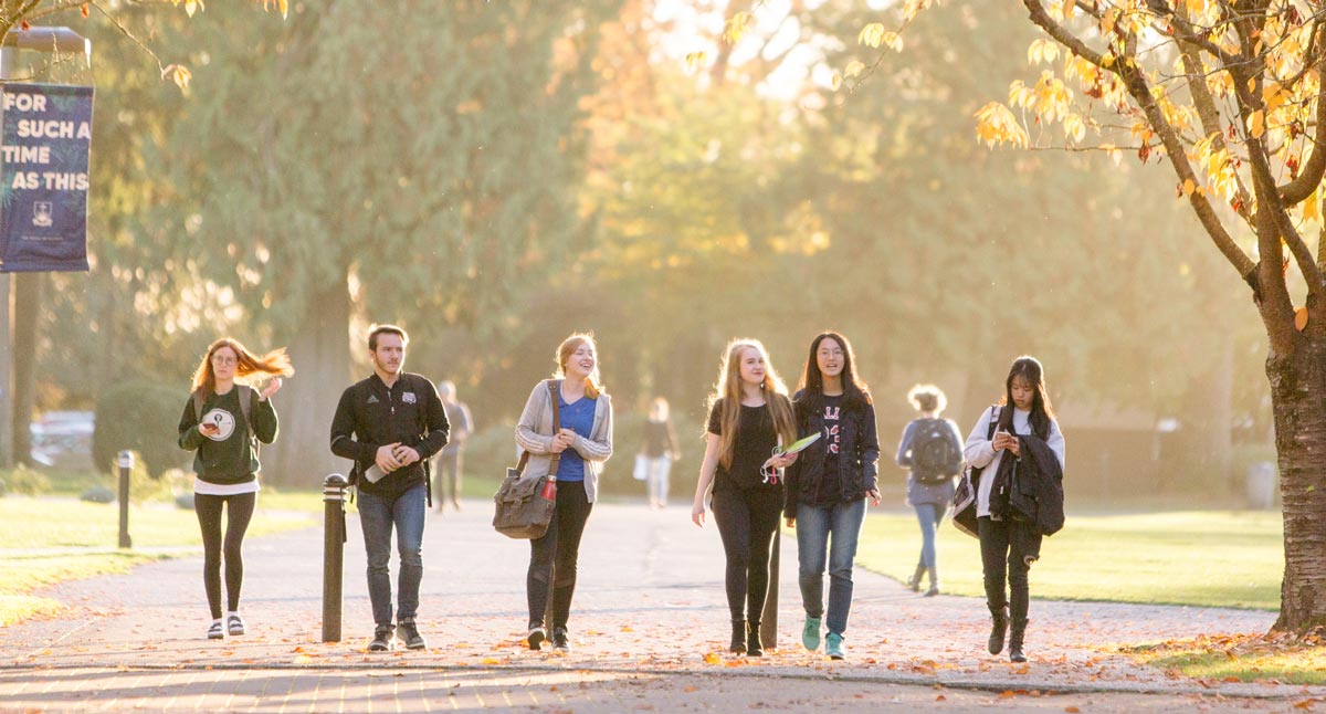 Trinity Western University students walk on campus