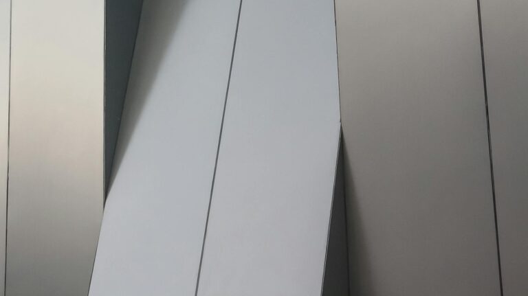 Detailed view of a modern geometric metal facade in Aguascalientes, Mexico.